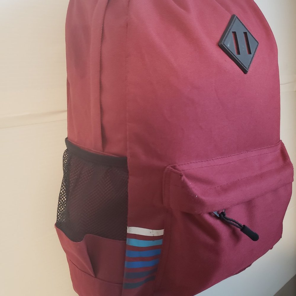 Bond Street Backpack red side stripes design white blue black pockets front hand - Picture 7 of 13